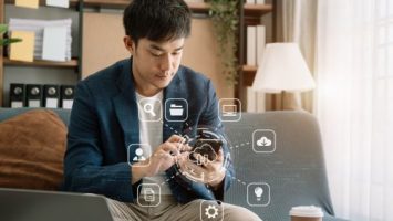 Male is using a smartphone and tablet to access storage and data transfer cloud network